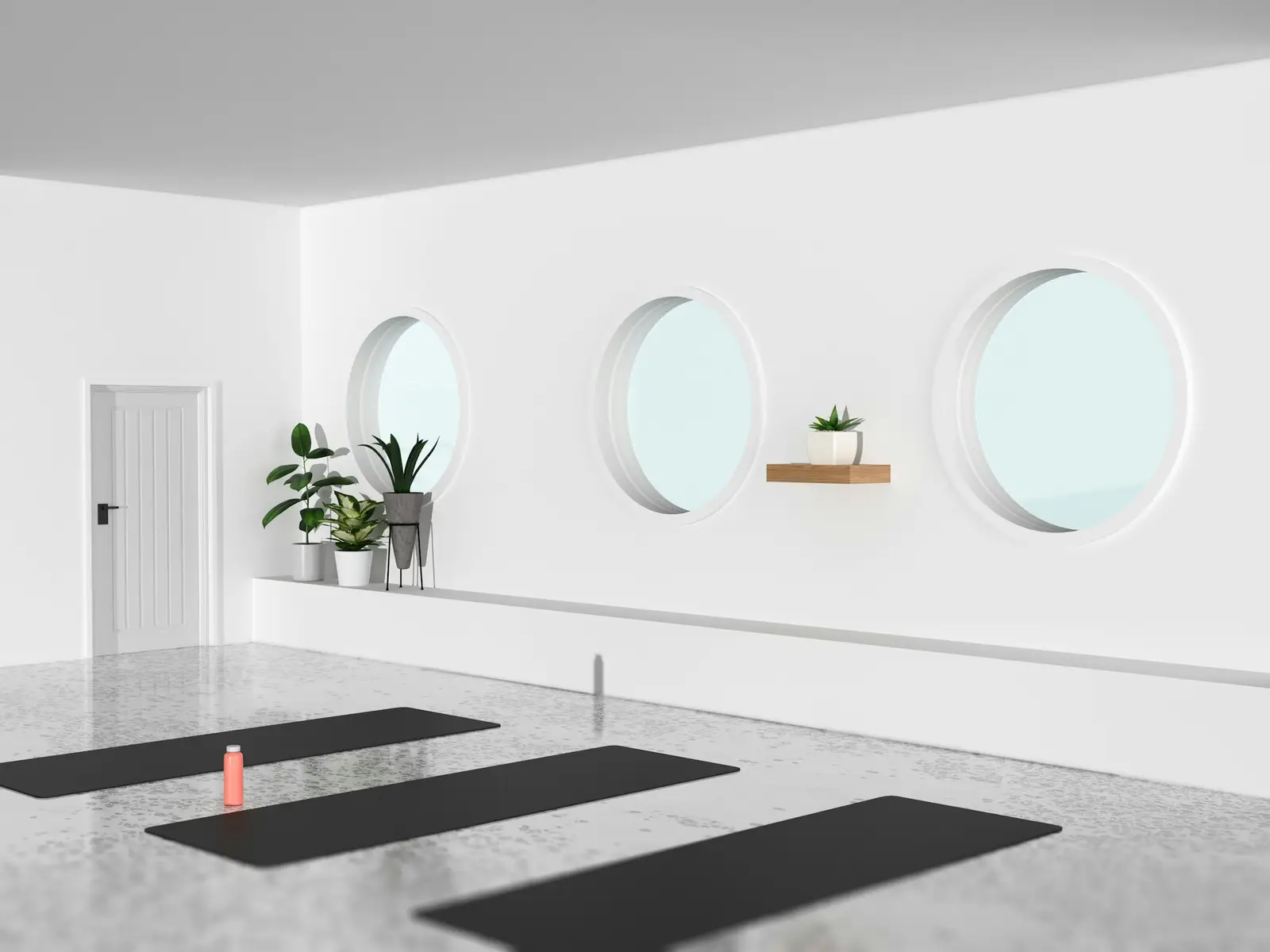 Salle de yoga lumineuse aux fenêtres rondes
